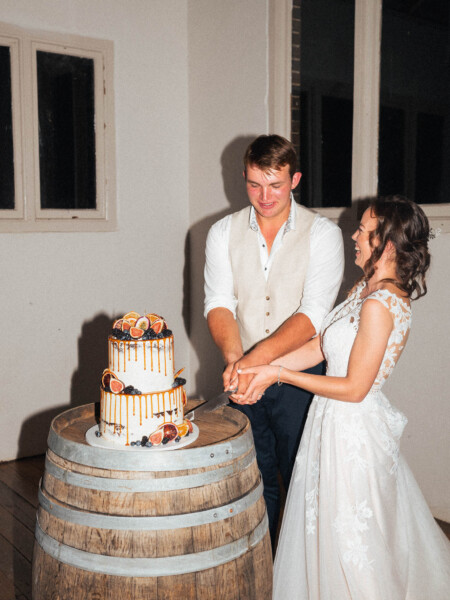 Photo of Bride & Groom Cutting Cake at Hunter Valley Wedding